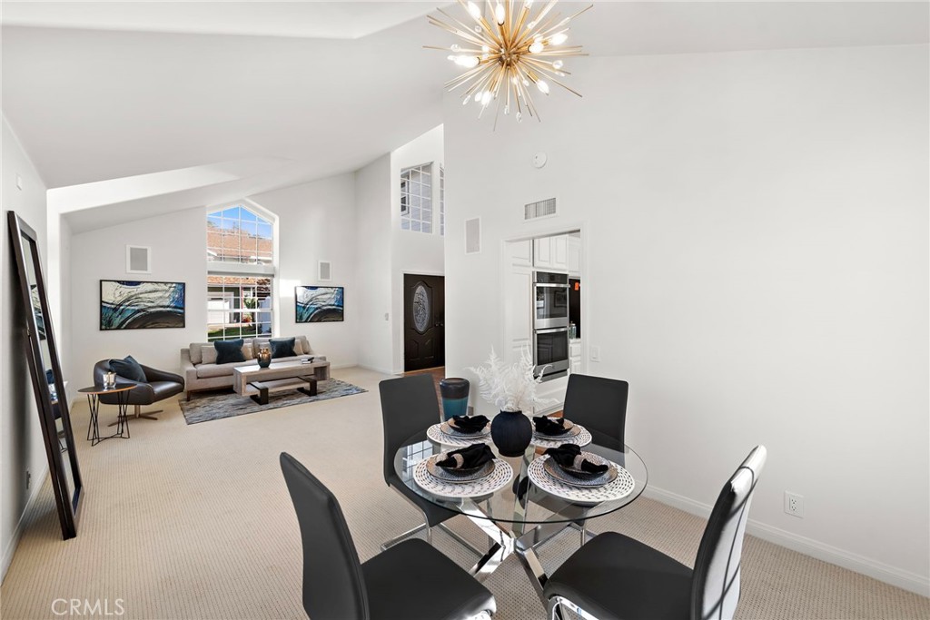 27552 Seascape Circle Dana Point, CA 92624 - Photo 14 of 39 a view of a dining room with furniture and a chandelier