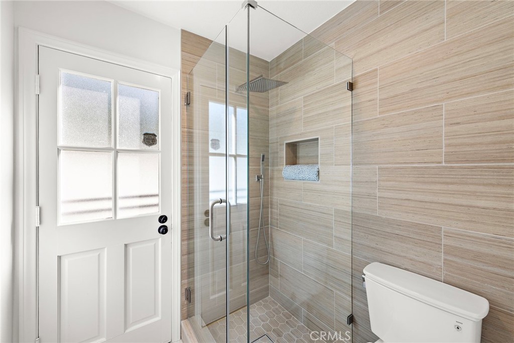 27552 Seascape Circle Dana Point, CA 92624 - Photo 16 of 39 a bathroom with a shower a toilet and sink