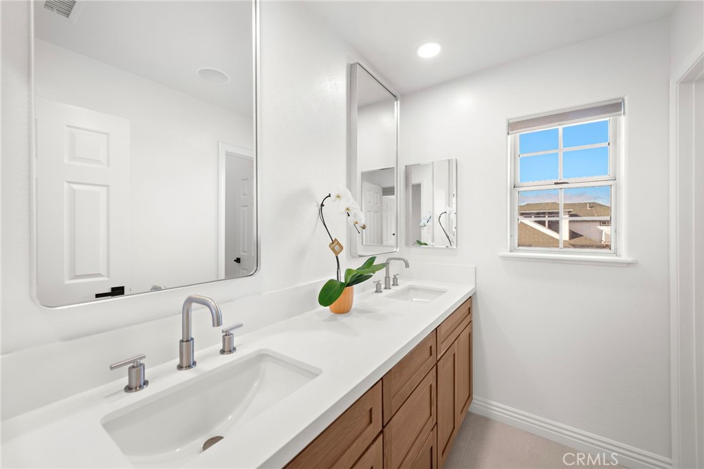 27552 Seascape Circle Dana Point, CA 92624 - Photo 24 of 39 a bathroom with a sink vanity and a mirror