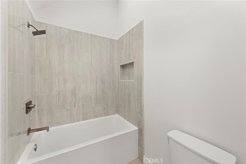 27552 Seascape Circle Dana Point, CA 92624 - Photo 26 of 39 a bathroom with a toilet and a bathtub