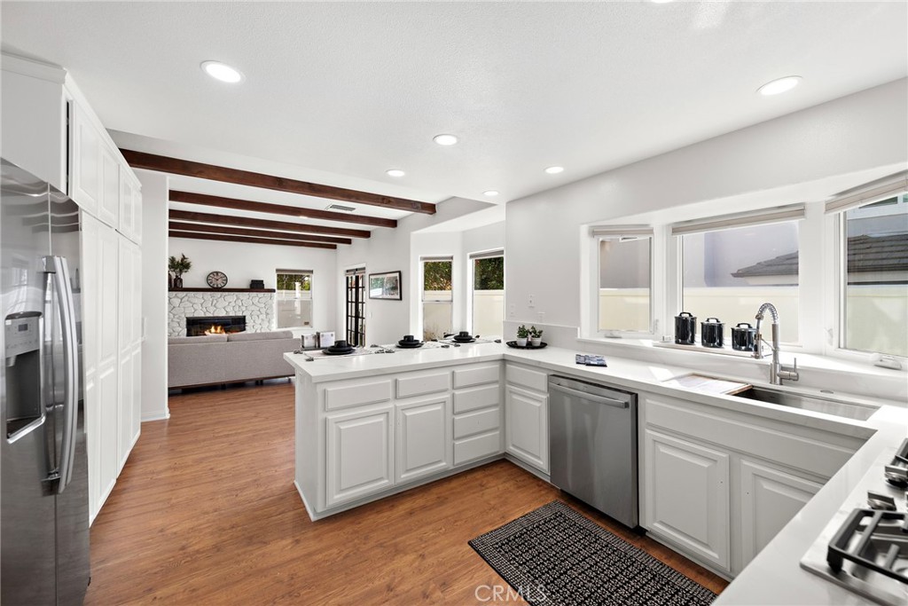 27552 Seascape Circle Dana Point, CA 92624 - Photo 3 of 39 a kitchen with cabinets a sink and appliances