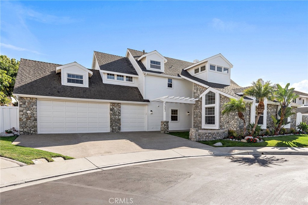 27552 Seascape Circle Dana Point, CA 92624 - Photo 37 of 39 a front view of a house with a yard and garage