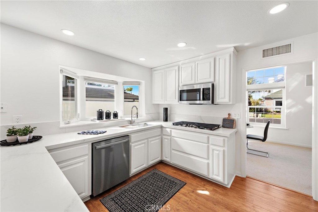 27552 Seascape Circle Dana Point, CA 92624 - Photo 5 of 39 a kitchen with a sink stove top oven and cabinets