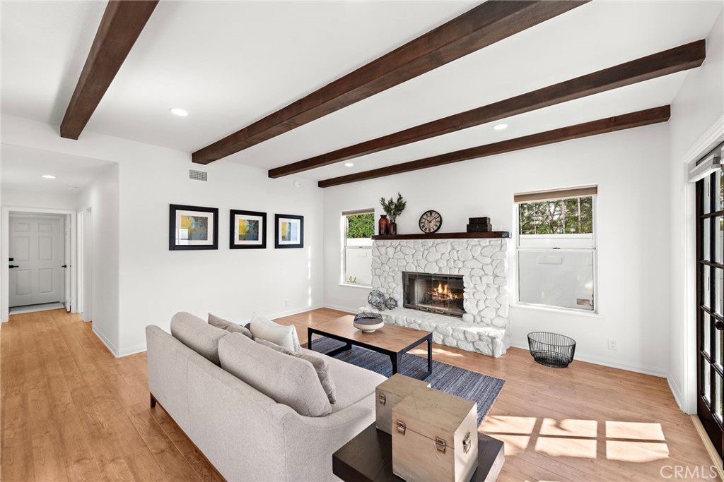 27552 Seascape Circle Dana Point, CA 92624 - Photo 10 of 39 a living room with furniture and a fireplace