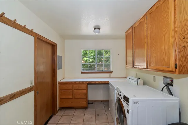 a view of a sink and dishwasher with wooden cabinets
