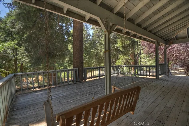 a view of a house with wooden deck