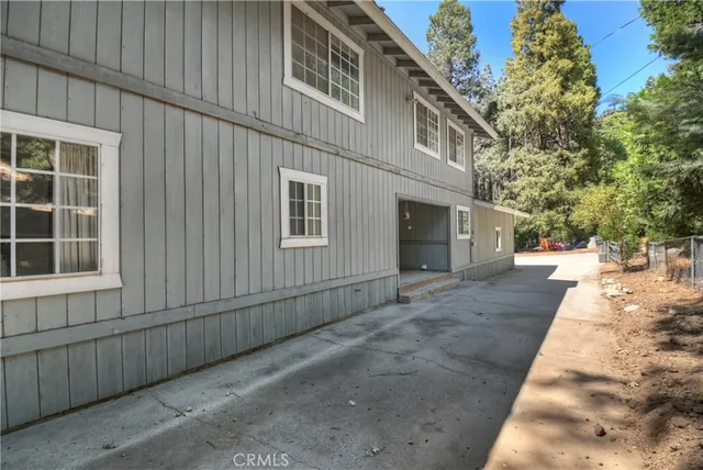 a view of a livingroom with furniture and a window