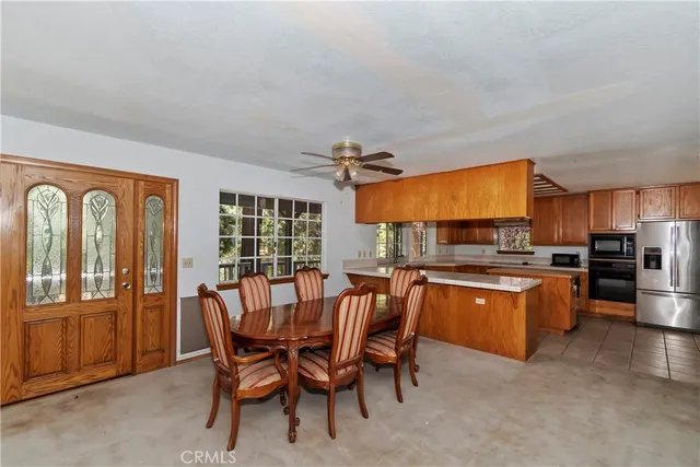 a view of a dining room with furniture window and outside view