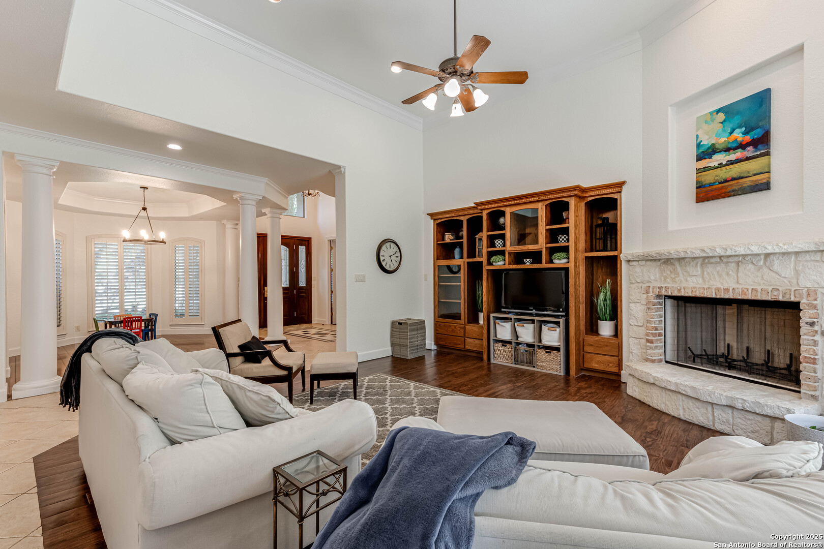 132 Long Bow Road Shavano Park, TX 78231 - Photo 13 of 50 a living room with furniture a fireplace and a flat screen tv