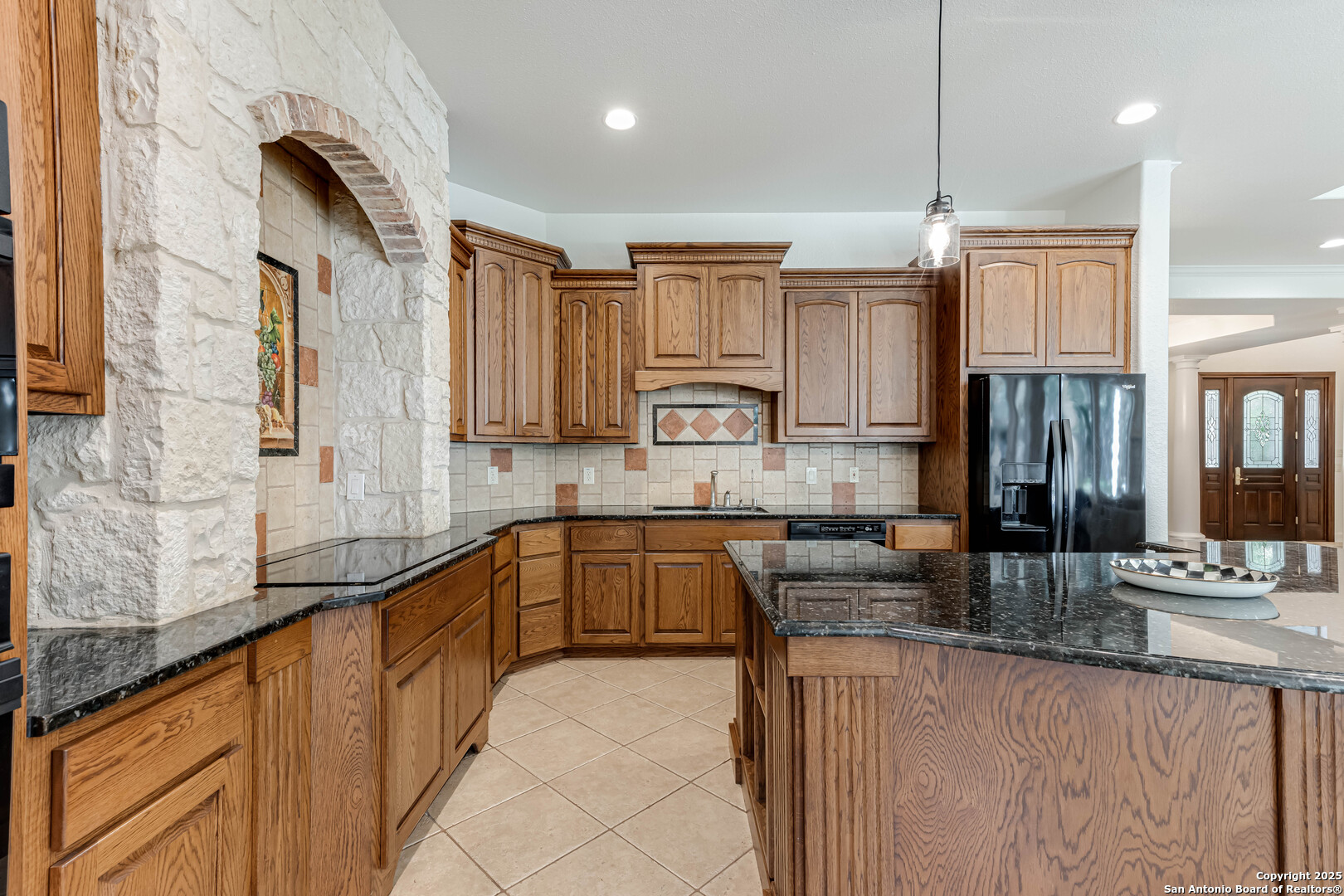 132 Long Bow Road Shavano Park, TX 78231 - Photo 18 of 50 a kitchen with stainless steel appliances granite countertop a sink refrigerator and cabinets