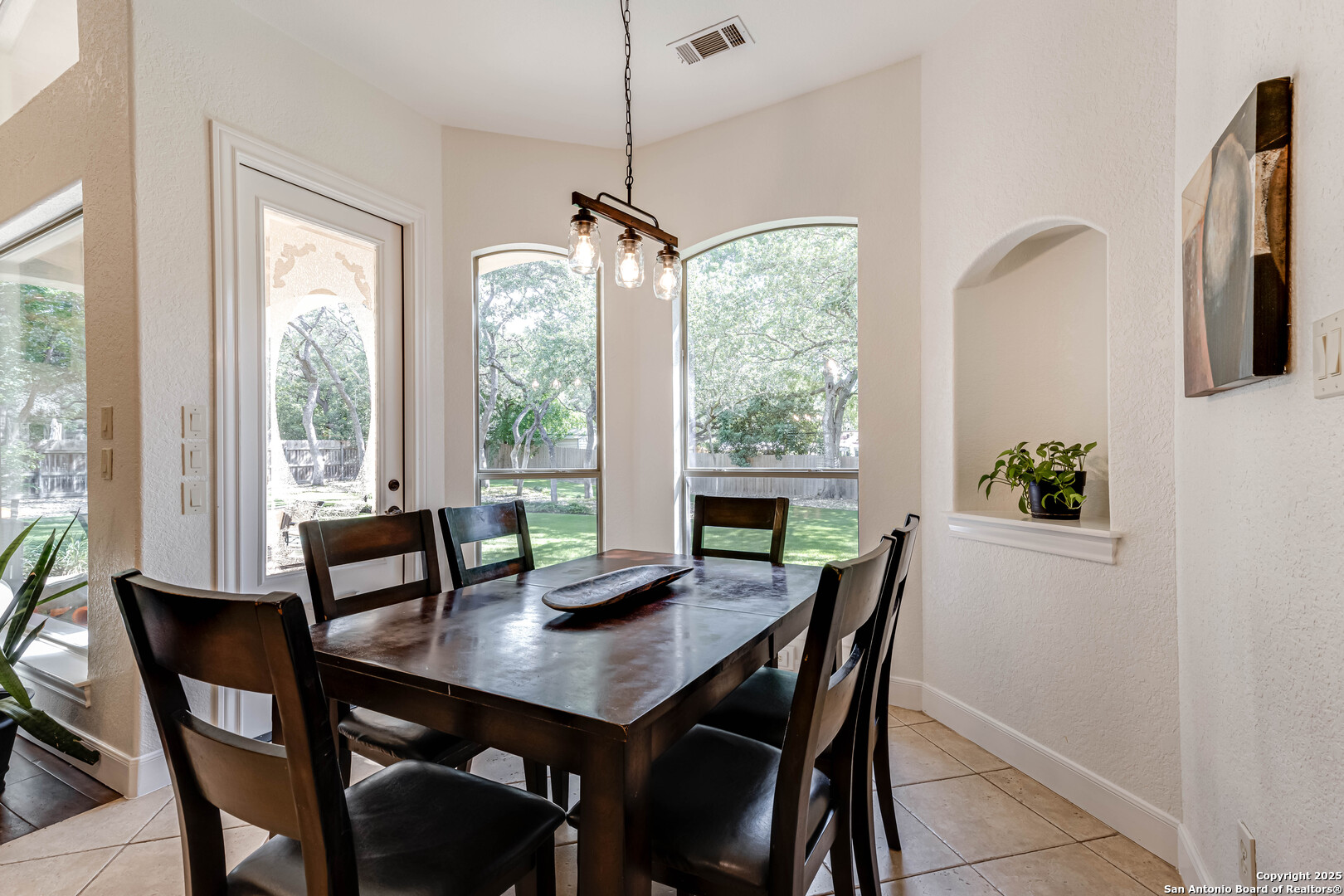 132 Long Bow Road Shavano Park, TX 78231 - Photo 19 of 50 a view of a dining room with furniture window and outside view