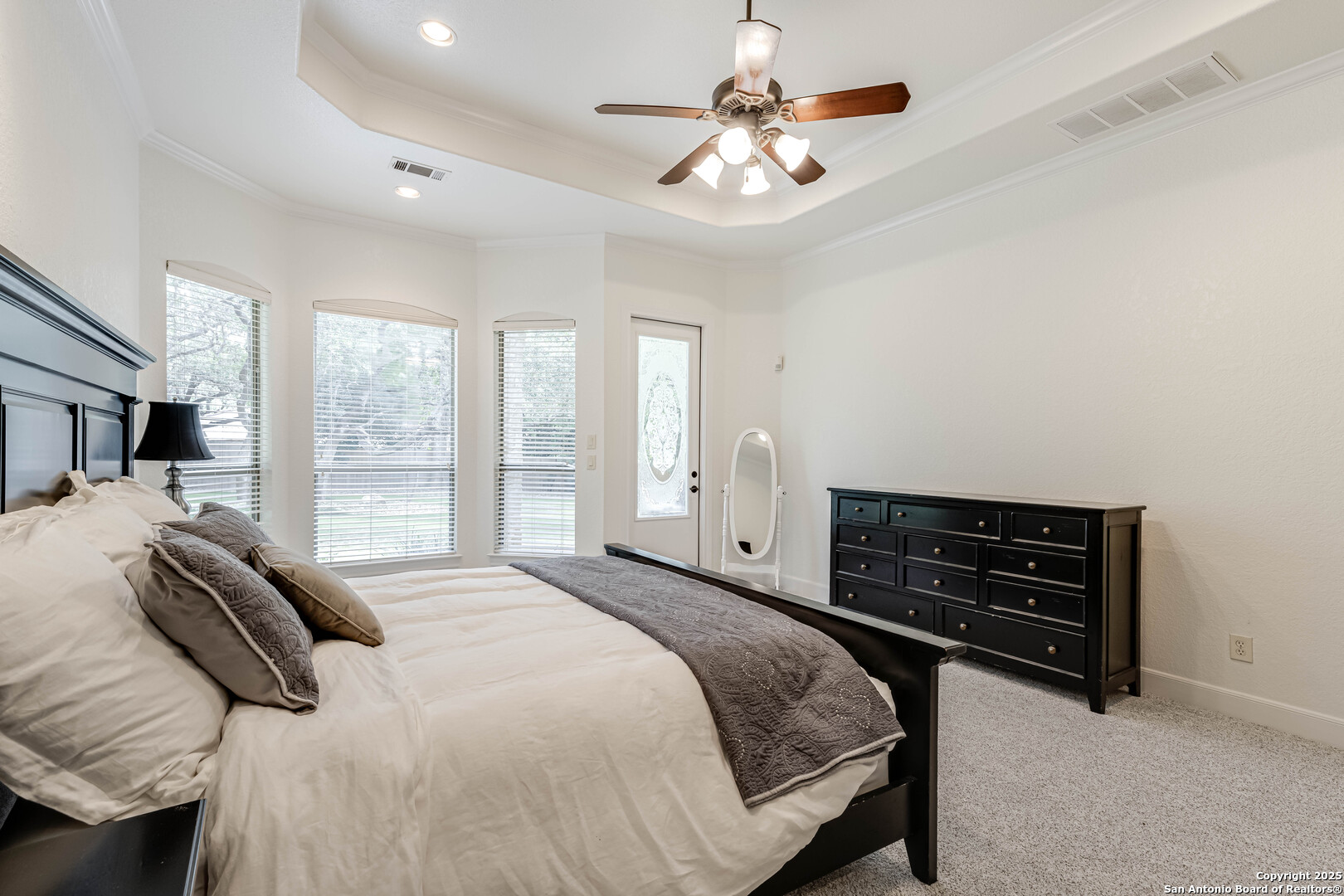 132 Long Bow Road Shavano Park, TX 78231 - Photo 26 of 50 a bedroom with a bed and a chandelier