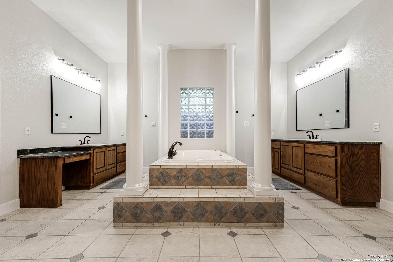 132 Long Bow Road Shavano Park, TX 78231 - Photo 27 of 50 a spacious bathroom with a double vanity sink and a mirror