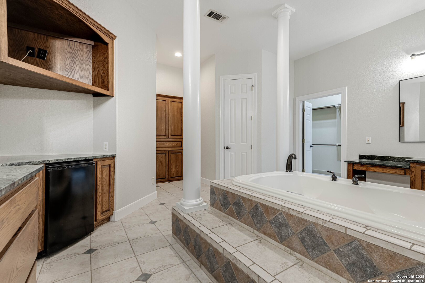 132 Long Bow Road Shavano Park, TX 78231 - Photo 29 of 50 a bathroom with a sink and a mirror
