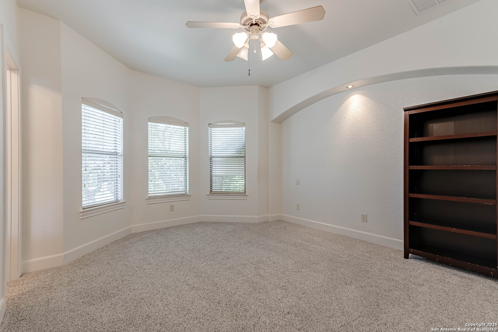 132 Long Bow Road Shavano Park, TX 78231 - Photo 40 of 50 a view of an empty room with a window and a kitchen
