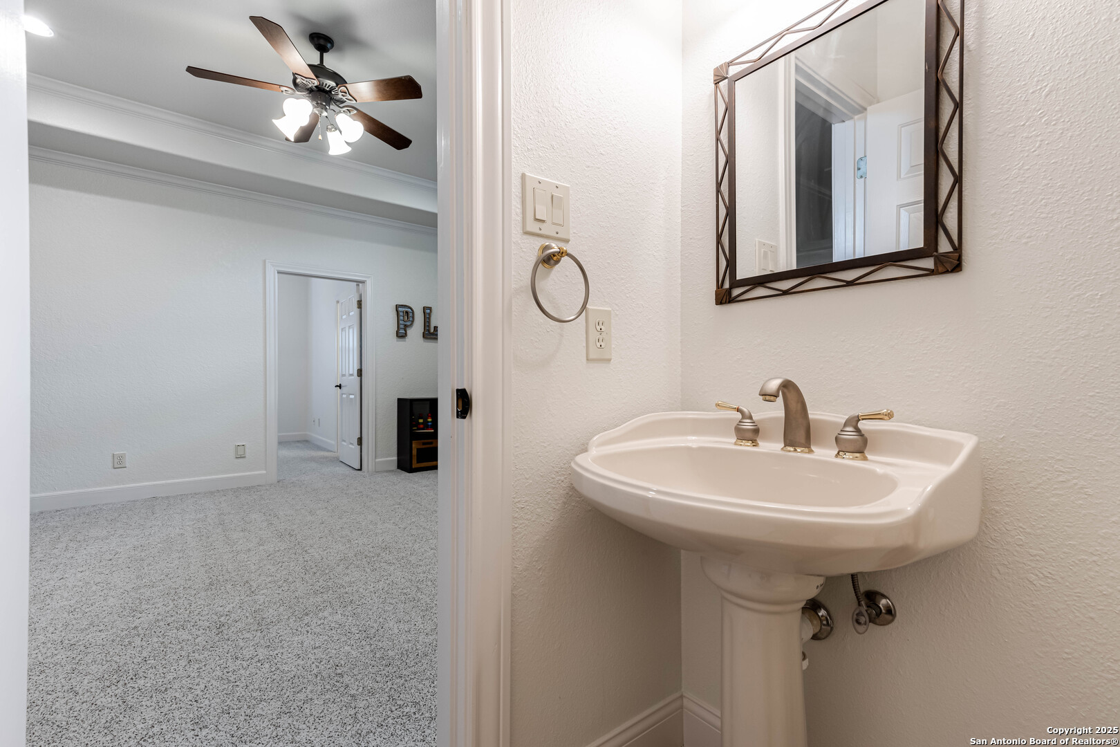 132 Long Bow Road Shavano Park, TX 78231 - Photo 42 of 50 a bathroom with a sink a mirror and vanity
