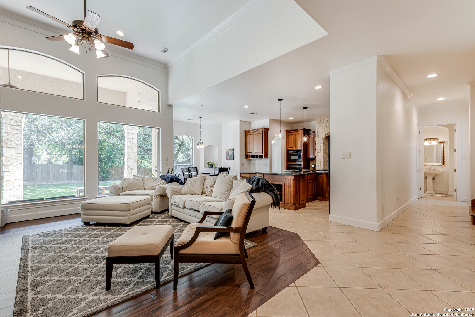 132 Long Bow Road Shavano Park, TX 78231 - Photo 10 of 50 a living room with fireplace furniture and a large window