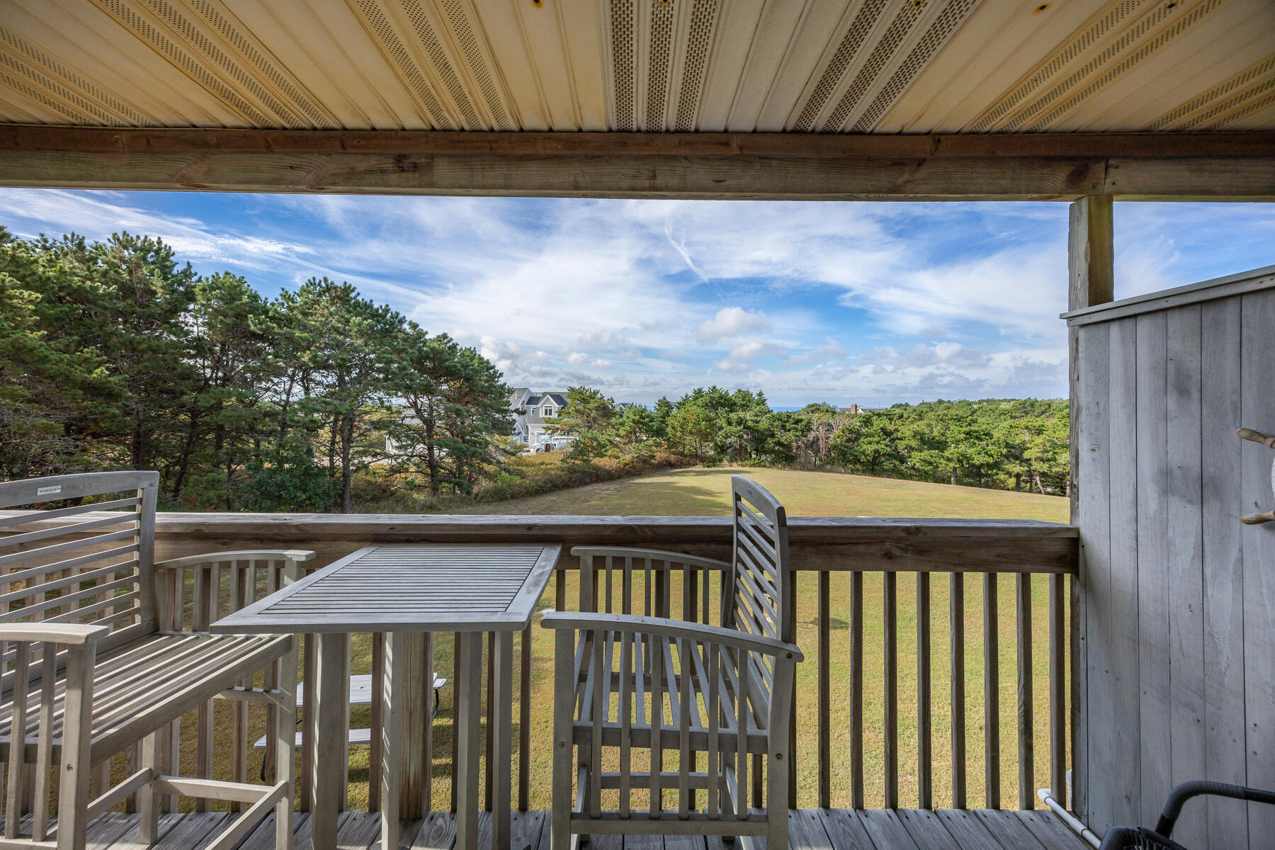 132 Shore Road, Unit 48 Truro, MA 02666 - Photo 19 of 35 a view of a balcony with wooden floor