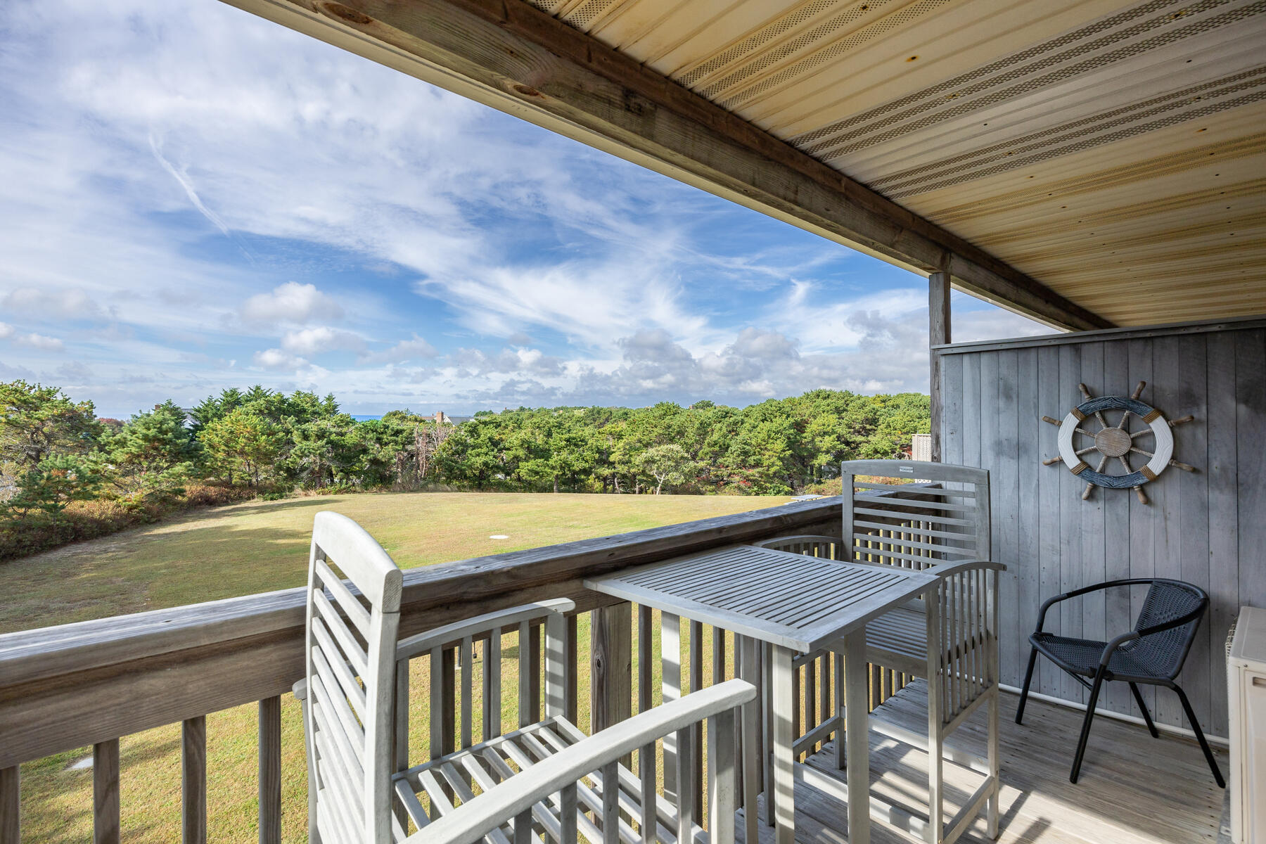 132 Shore Road, Unit 48 Truro, MA 02666 - Photo 20 of 35 a view of a balcony with chair and wooden floor