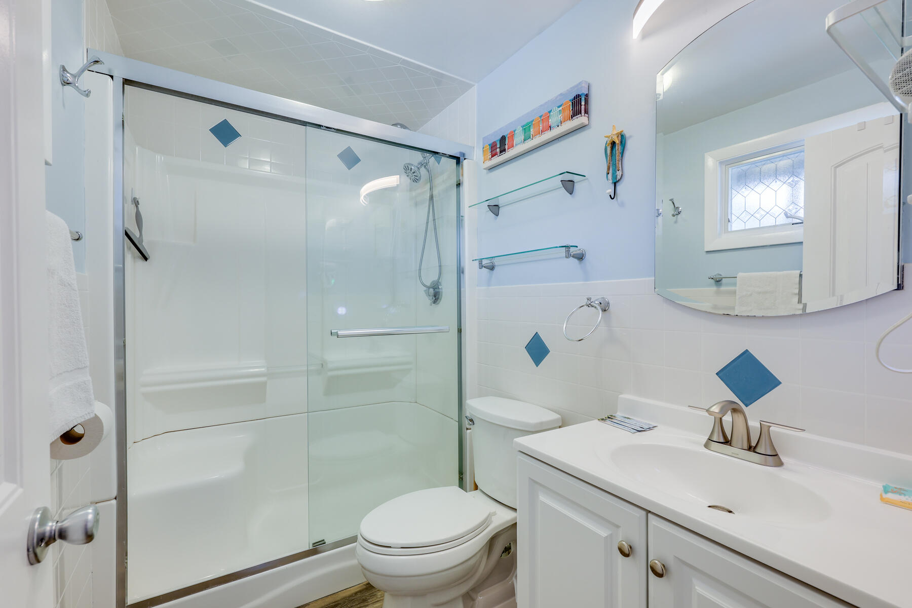 132 Shore Road, Unit 48 Truro, MA 02666 - Photo 22 of 35 a bathroom with a sink toilet vanity and shower