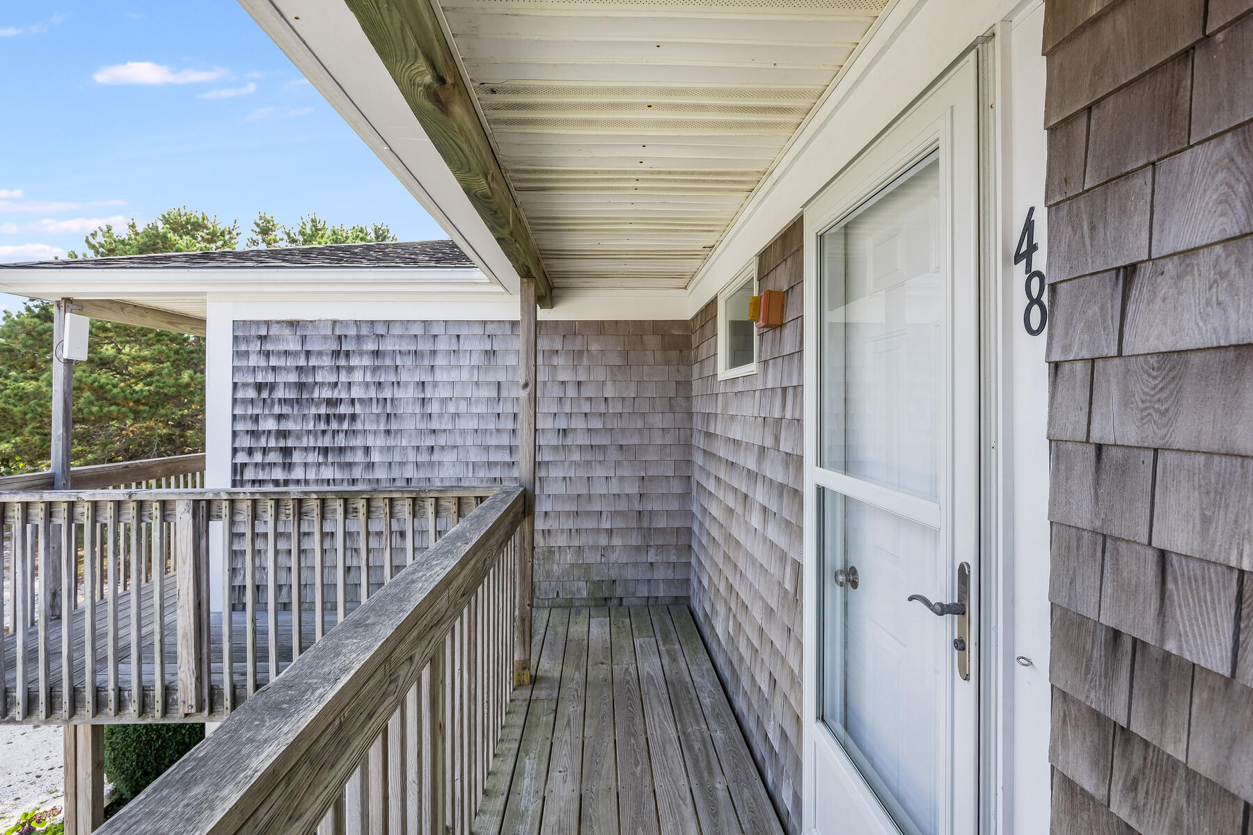 132 Shore Road, Unit 48 Truro, MA 02666 - Photo 28 of 35 a view of a balcony with wooden floor