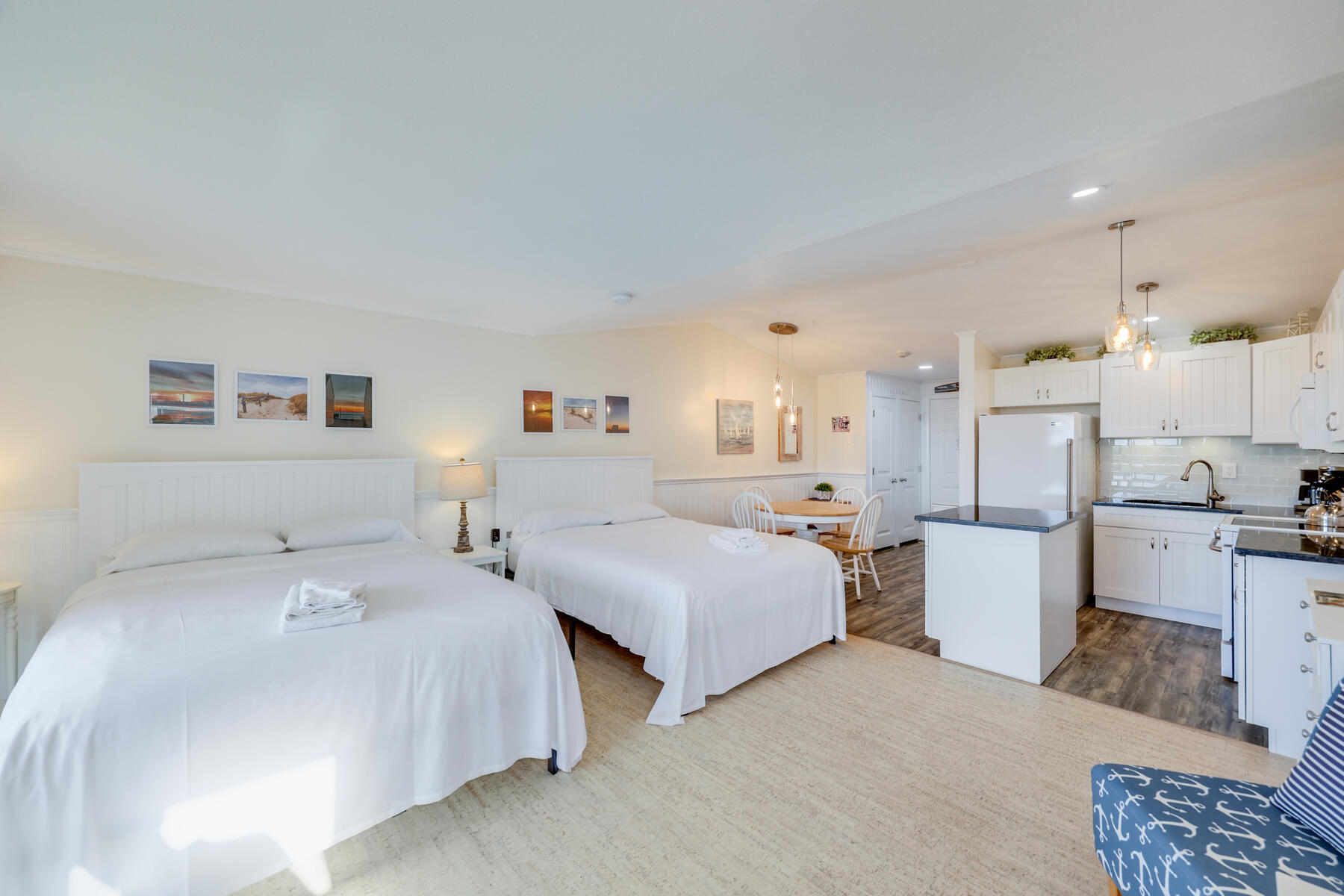 132 Shore Road, Unit 48 Truro, MA 02666 - Photo 10 of 35 a bedroom with two beds and painting on the wall