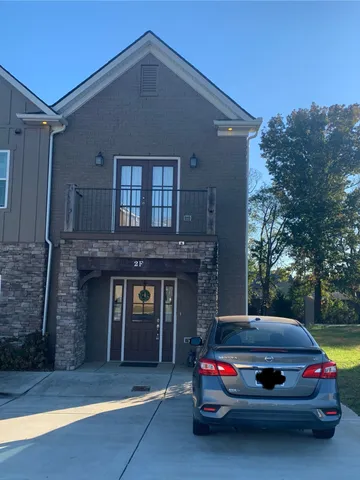 a car parked in front of a house
