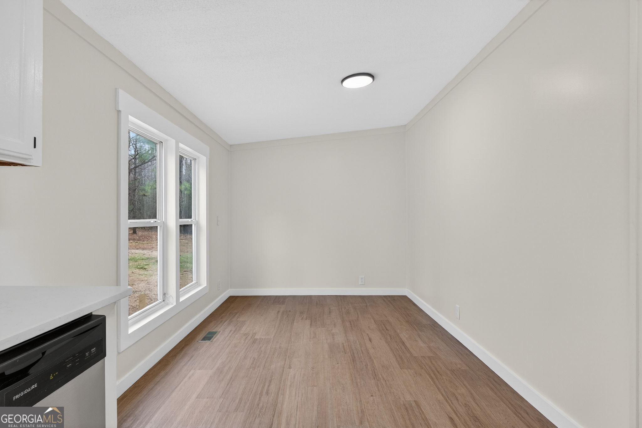 329 Brook Road Barnesville, GA 30204 - Photo 14 of 37 a view of a livingroom with wooden floor and window
