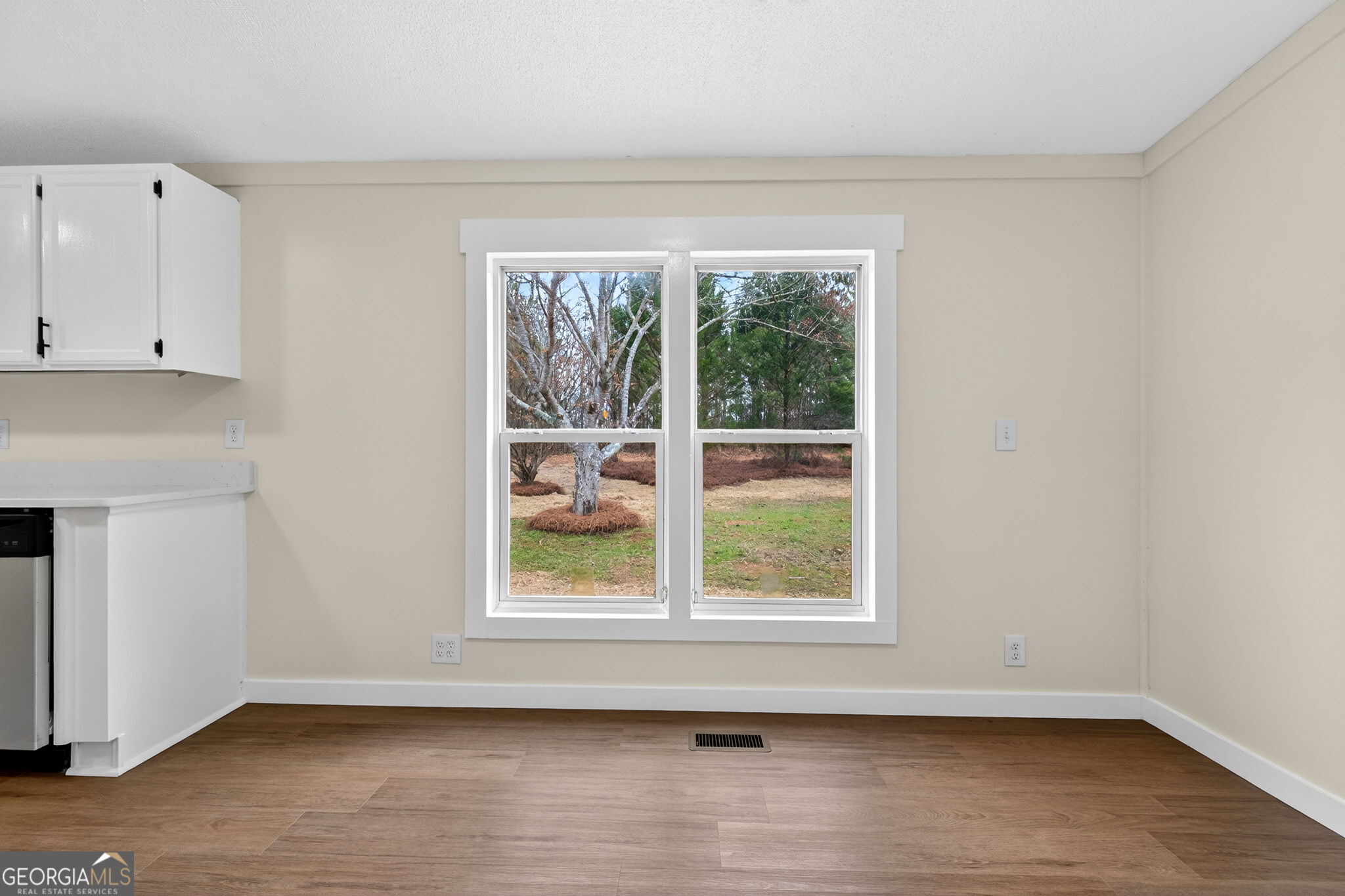 329 Brook Road Barnesville, GA 30204 - Photo 15 of 37 an empty room with wooden floor and windows