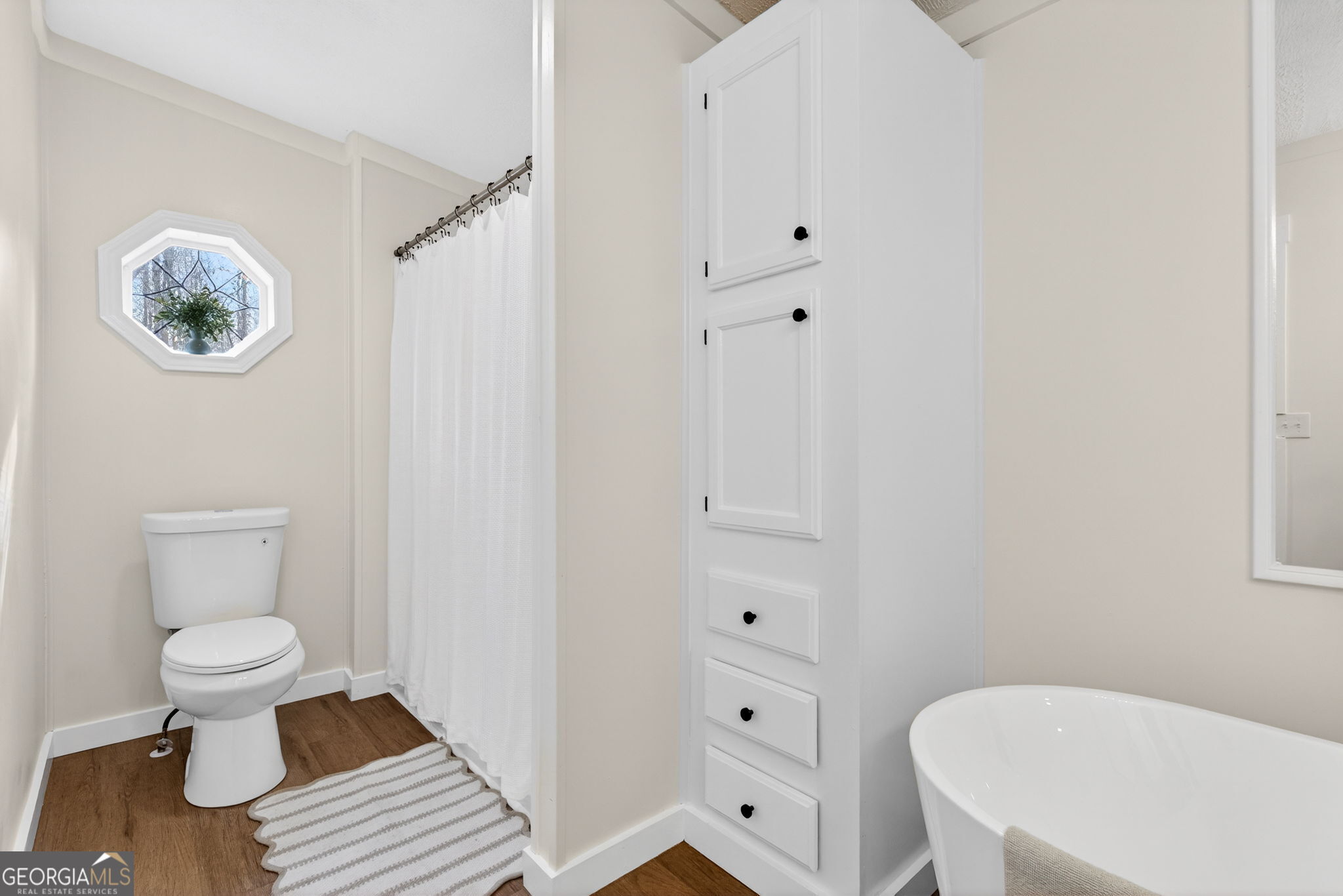 329 Brook Road Barnesville, GA 30204 - Photo 26 of 37 a bathroom with a toilet a sink and a mirror