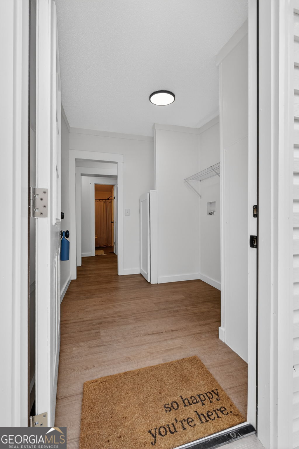 329 Brook Road Barnesville, GA 30204 - Photo 30 of 37 a view of a hallway with wooden floor and a bathroom