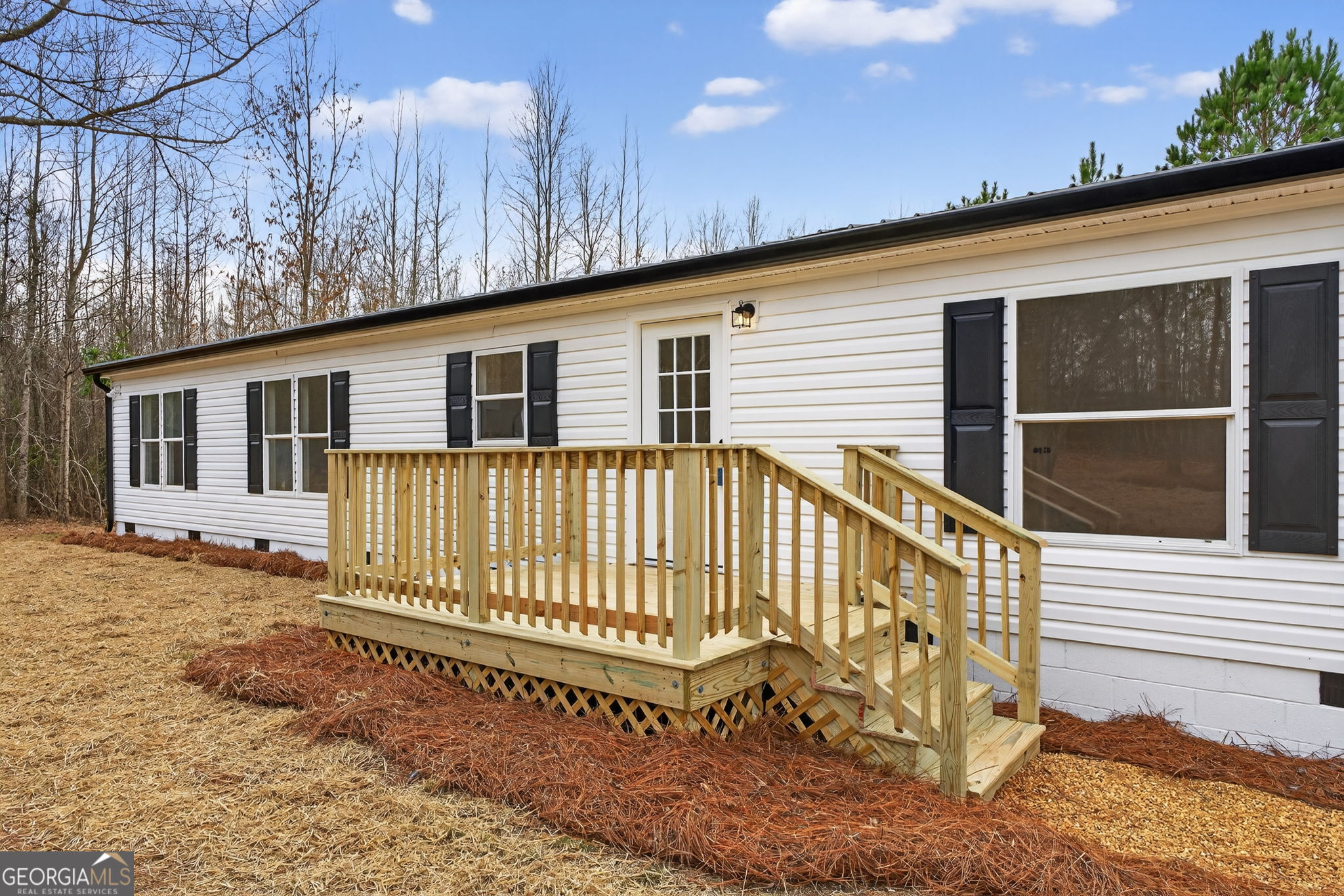 329 Brook Road Barnesville, GA 30204 - Photo 32 of 37 a view of a house with a wooden deck