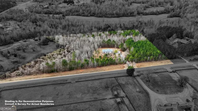 a view of a yard with potted plants