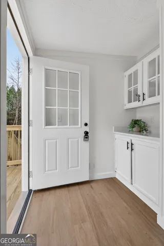 a view of a livingroom with an empty space and a window