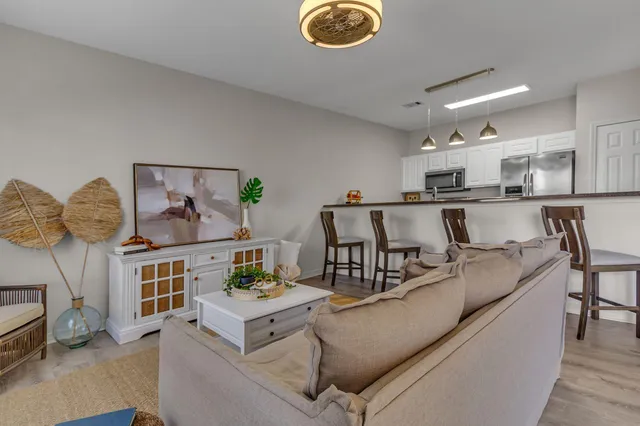 a living room with furniture and a table