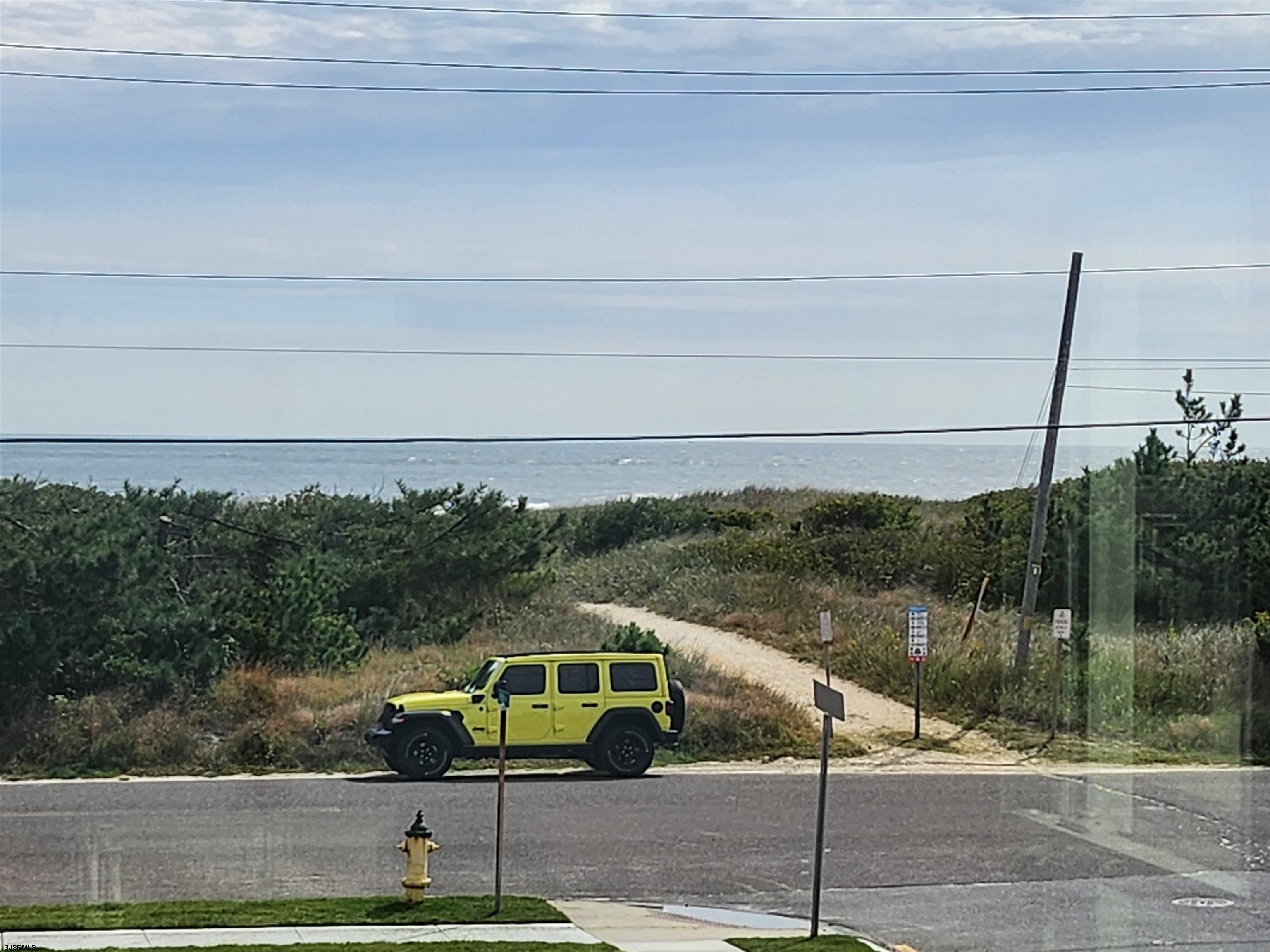 353 11th Street South, Unit 2 Brigantine, NJ 08203 - Photo 17 of 17 a view of a balcony with floor to ceiling windows