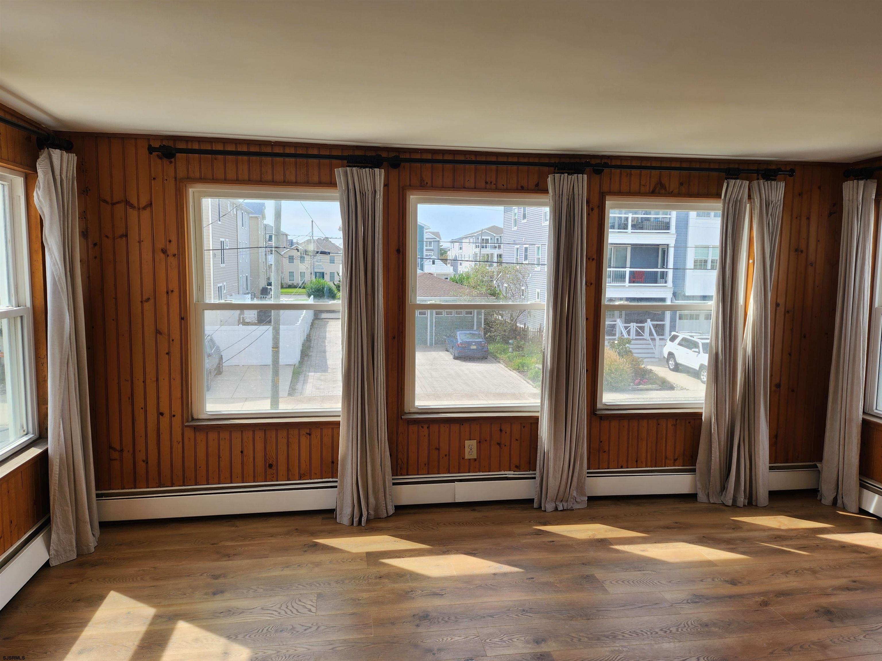 353 11th Street South, Unit 2 Brigantine, NJ 08203 - Photo 6 of 17 an empty room with windows