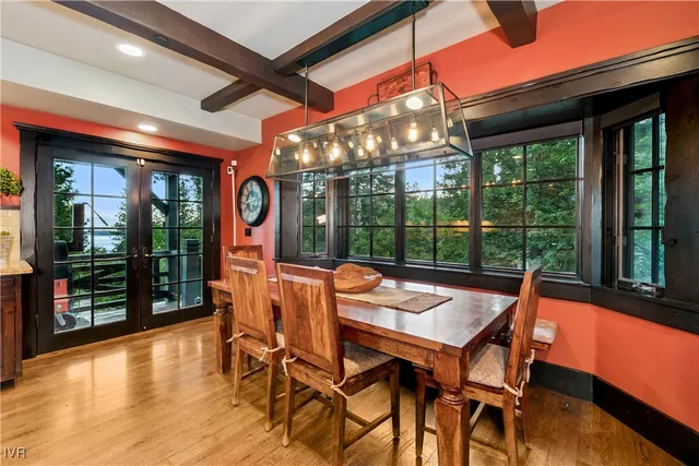 a view of a dining room with furniture wooden floor and chandelier