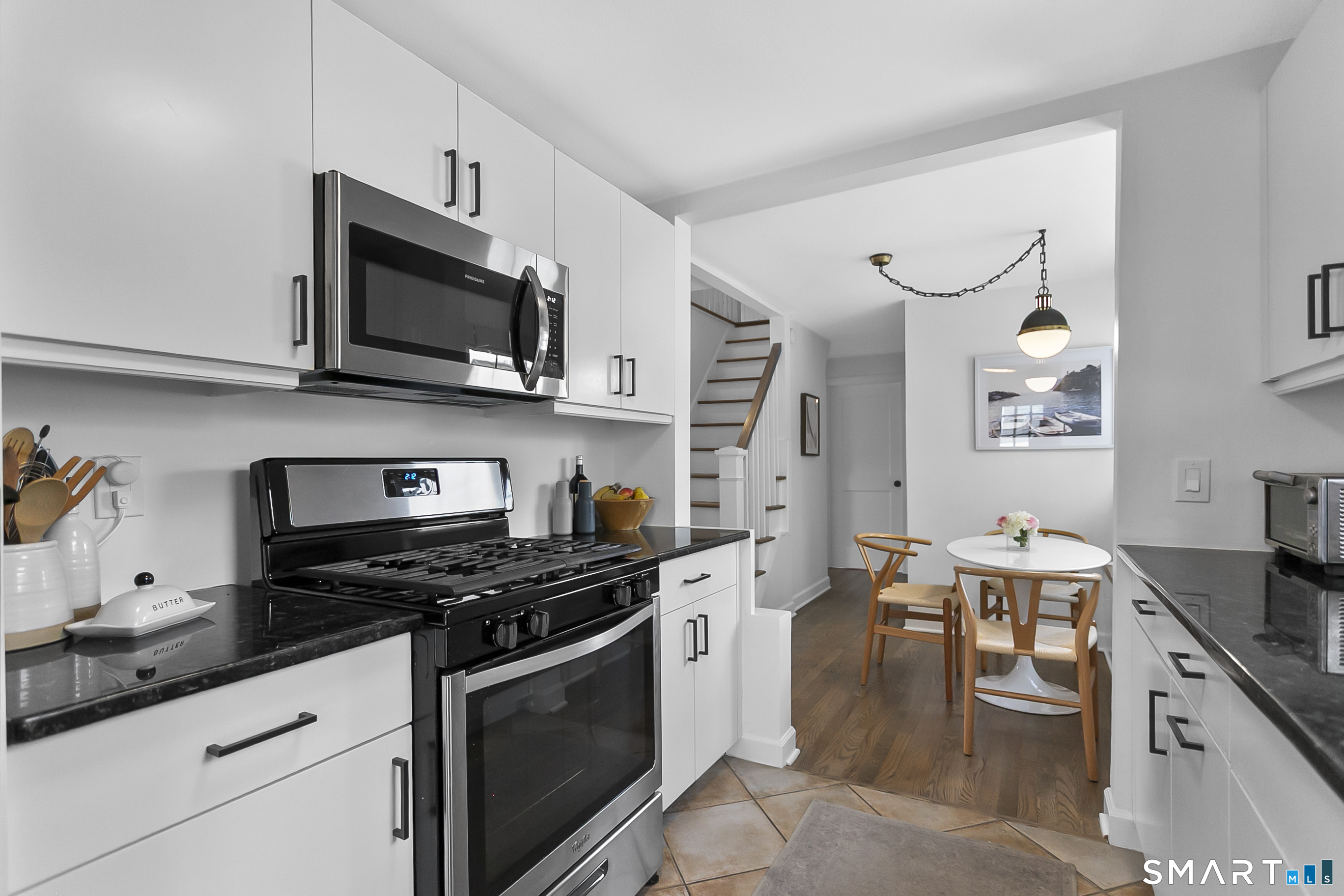 121 Alden Street Fairfield, CT 06824 - Photo 12 of 29 a kitchen with stainless steel appliances a stove microwave and cabinets