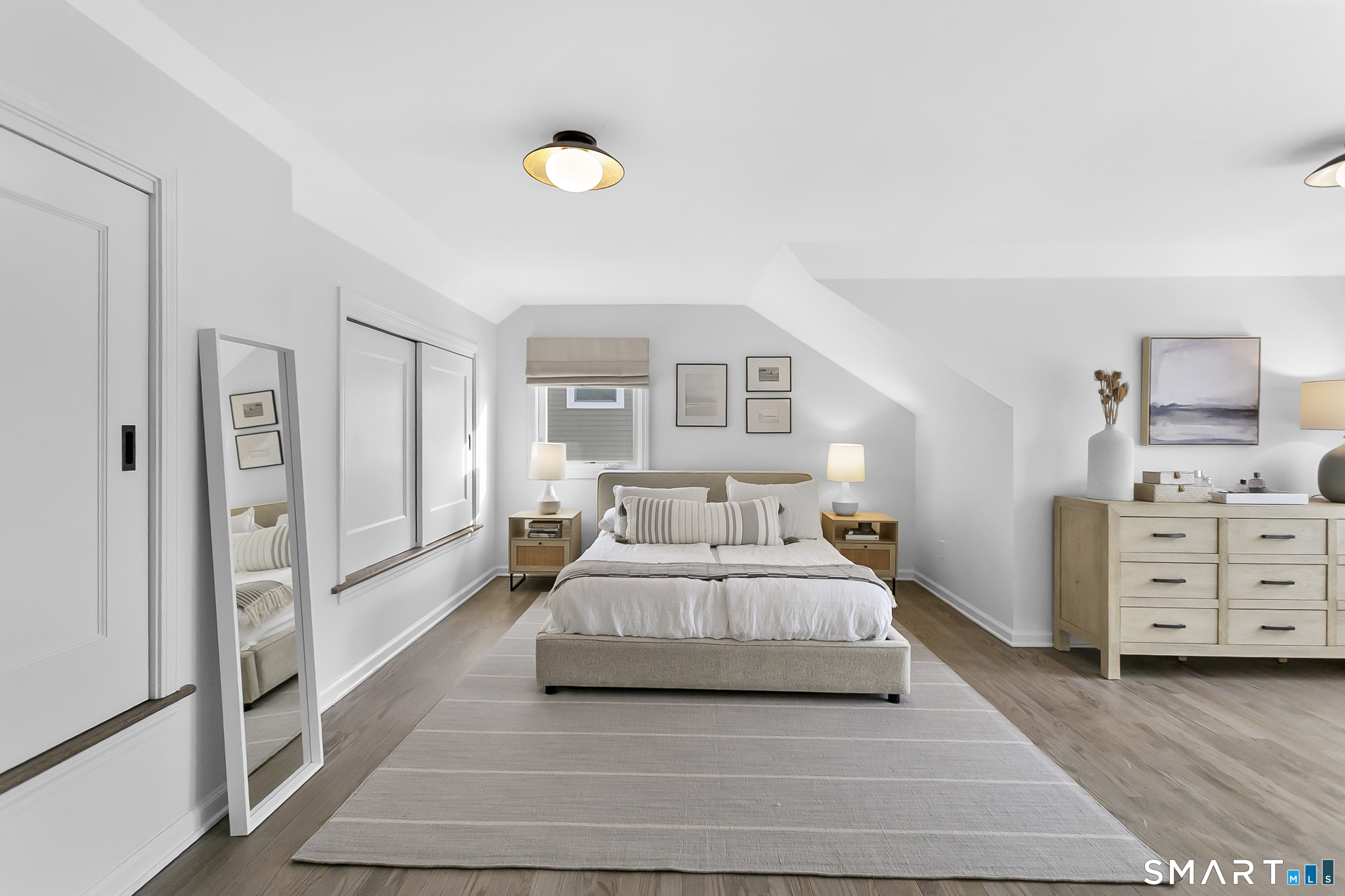 121 Alden Street Fairfield, CT 06824 - Photo 20 of 29 a spacious bedroom with a bed and cabinet