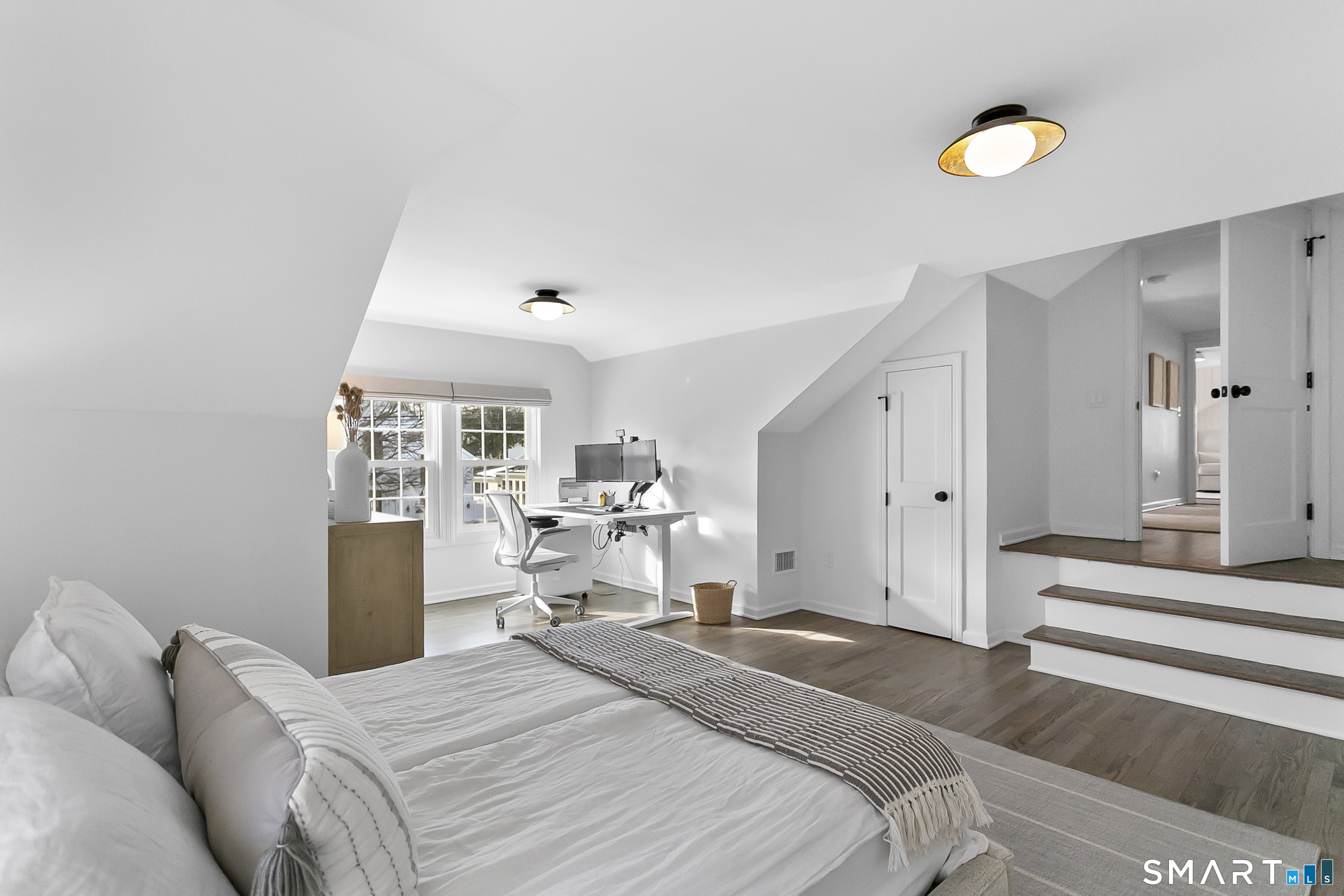 121 Alden Street Fairfield, CT 06824 - Photo 21 of 29 a bedroom with a bed and a chandelier