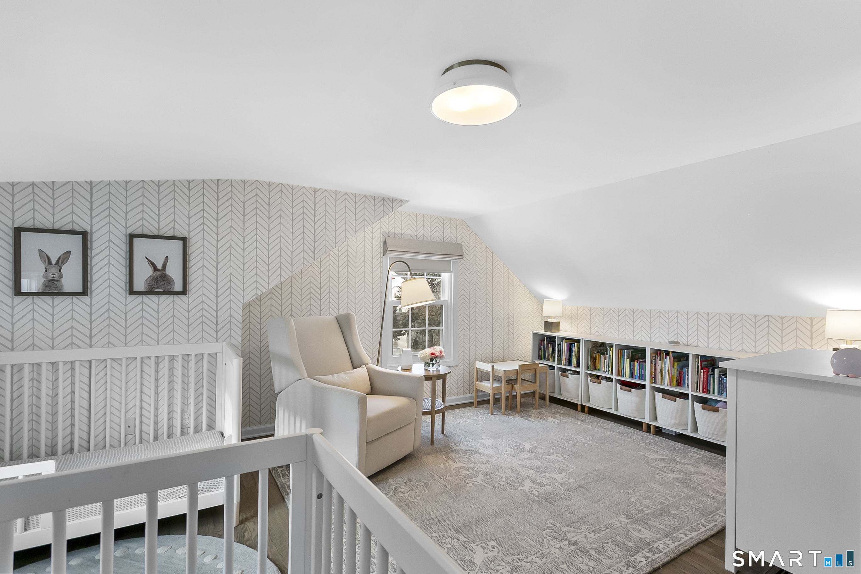 121 Alden Street Fairfield, CT 06824 - Photo 23 of 29 a living room with furniture and a book shelf
