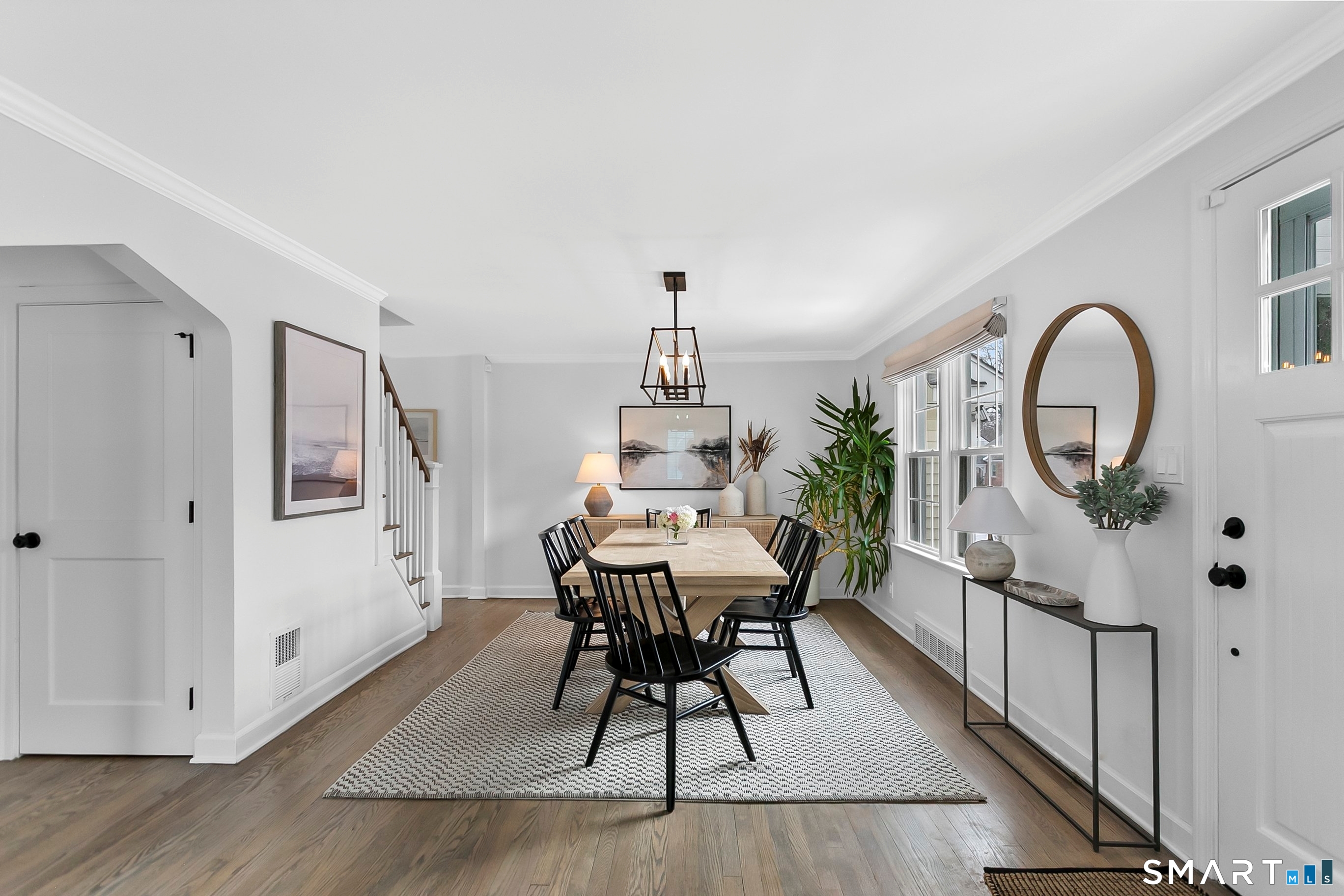 121 Alden Street Fairfield, CT 06824 - Photo 9 of 29 a view of a dining room with furniture window and wooden floor