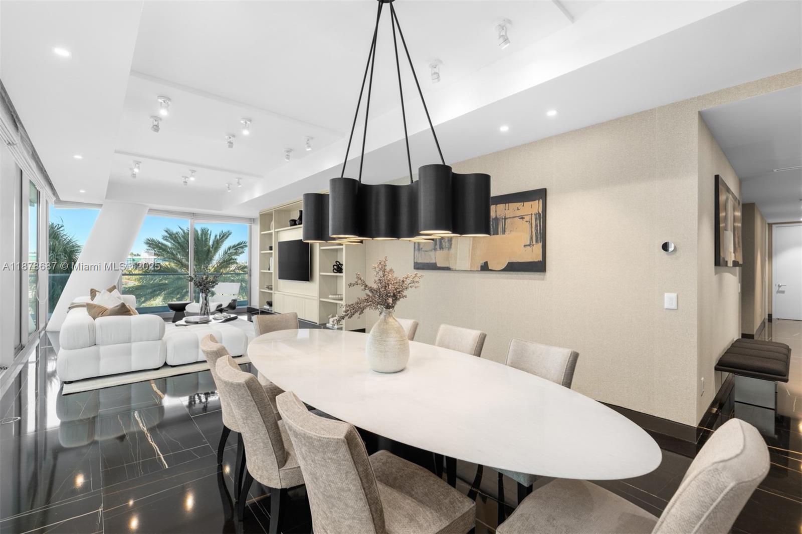 9349 Collins Avenue, Unit 406 Surfside, FL 33154 - Photo 17 of 48 a view of a dining room with furniture