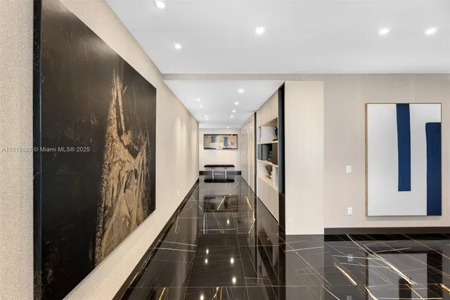 a view of a hallway with windows