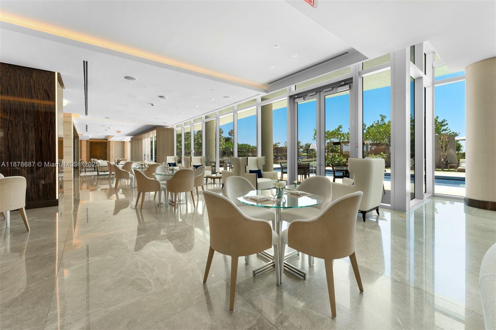 9349 Collins Avenue, Unit 406 Surfside, FL 33154 - Photo 38 of 48 a dining room with furniture water view and a floor to ceiling window