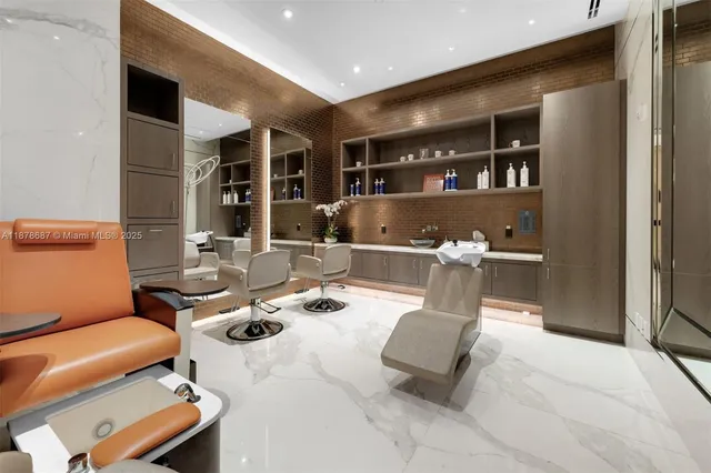 a living room with furniture a large window and bookshelf