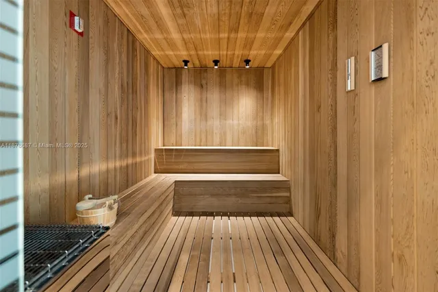 a bathroom with a granite countertop window and a wooden floor