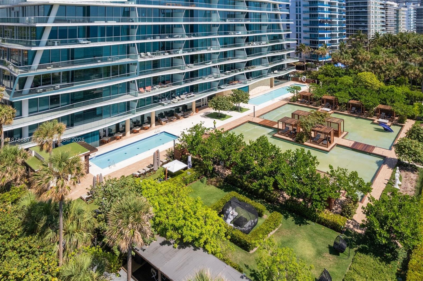 9349 Collins Avenue, Unit 406 Surfside, FL 33154 - Photo 46 of 48 a picture of a building with a garden