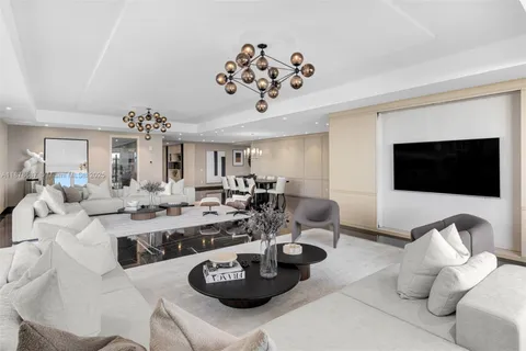 a living room with lots of furniture and a flat screen tv